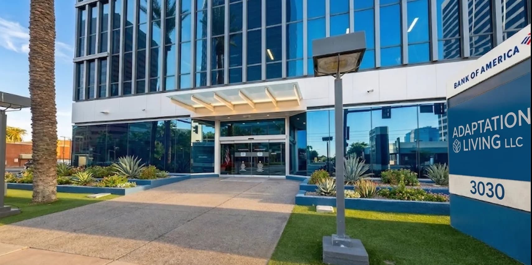 Adaptation Living LLC headquarters in Phoenix AZ — the company monument sign at 3030 North Central Avenue, inside the Bank of America Tower.